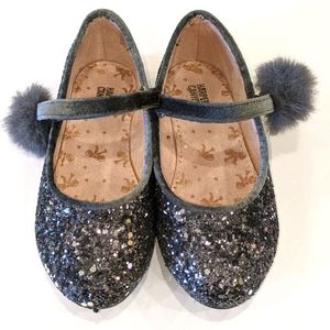 Sparkly gray flats with pom poms
